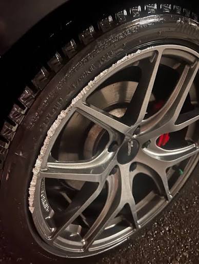 Alloy wheel with curb rash damage